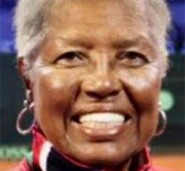 Woman smiling on tennis court