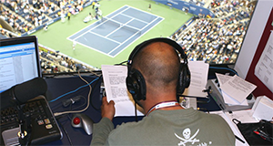 Tennis announcer in announcer booth