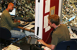 two tennis announcers in booths